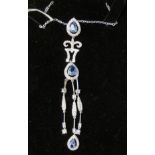 A silver and blue topaz set pendant necklet,