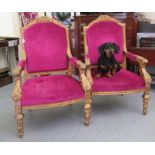 A pair of 20thC gilt gesso framed throne design salon chair,