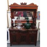 A late Victorian carved mahogany dresser, having a shaped, dentil moulded cornice,