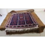 Four Bokhara and other rugs: to include an old gold and multi-coloured grounds largest 55'' x 46''