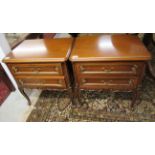 A pair of modern Continental inspired, carved and parcel gilt mahogany, two drawer bedside chests,
