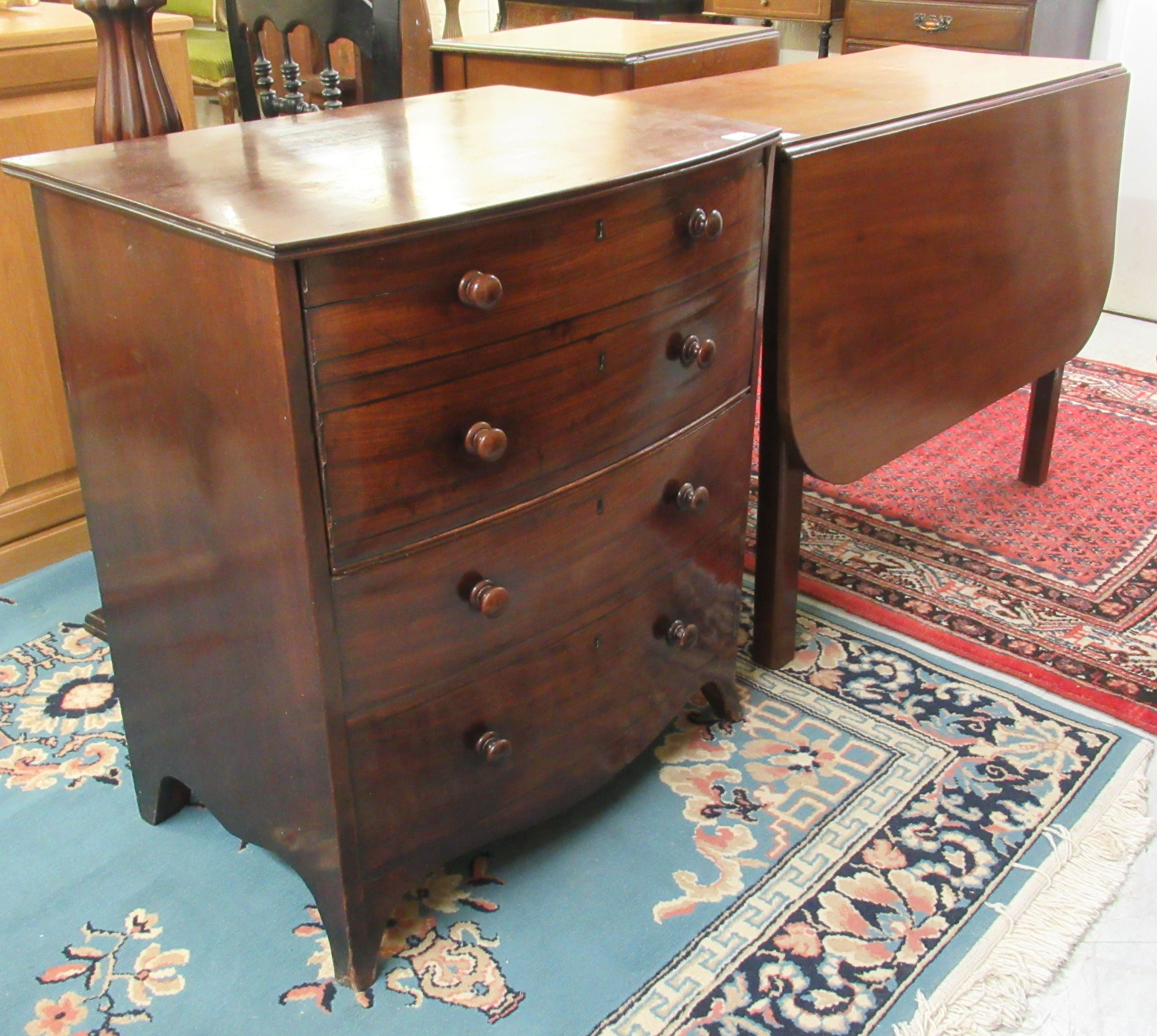 An early 19thC mahogany bowfront night commode, fashioned as a chest of drawers,