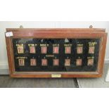 An Edwardian Hewson & Low maids mahogany signal box,