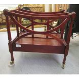 A Regency style mahogany divided Canterbury, on a box drawer base,