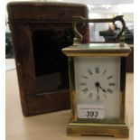 A mid 20thC brass cased carriage clock faced by a Roman dial 5''h with a fitted case OS3