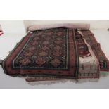 Five Persian and other rugs on multi-coloured grounds largest 46'' x 58'' RSM