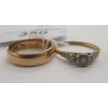 A yellow metal diamond solitaire ring;