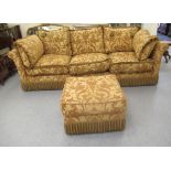 A modern three person settee with a low back and level, scrolled arms,