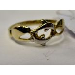 A bi-coloured gold dolphin ring 11