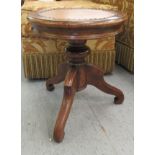 A late 19thC mahogany table/stool with a soft finished, stud upholstered, fabric lined top,