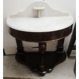 A late Victorian mahogany Duchess style D-shaped washstand with a mottled grey marble top,