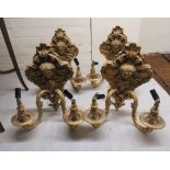 A set of four Victorian style twin branch, gilded iron,