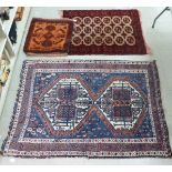 Rugs: to include a Persian example, decorated with a double pole medallion,