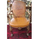 An early 20thC Queen Anne inspired mahogany framed elbow chair,