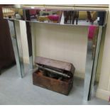 A 20thC mirrored console table, raised on square,