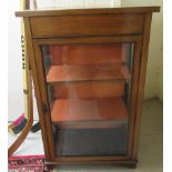 An Edwardian satinwood inlaid mahogany display cabinet with a glazed door and sides,