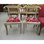 A pair of 20thC Regency style metal clad hall chairs, the crest with ram's head terminals,