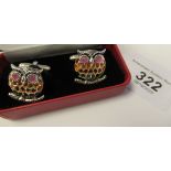 A pair of silver owl design cufflinks,