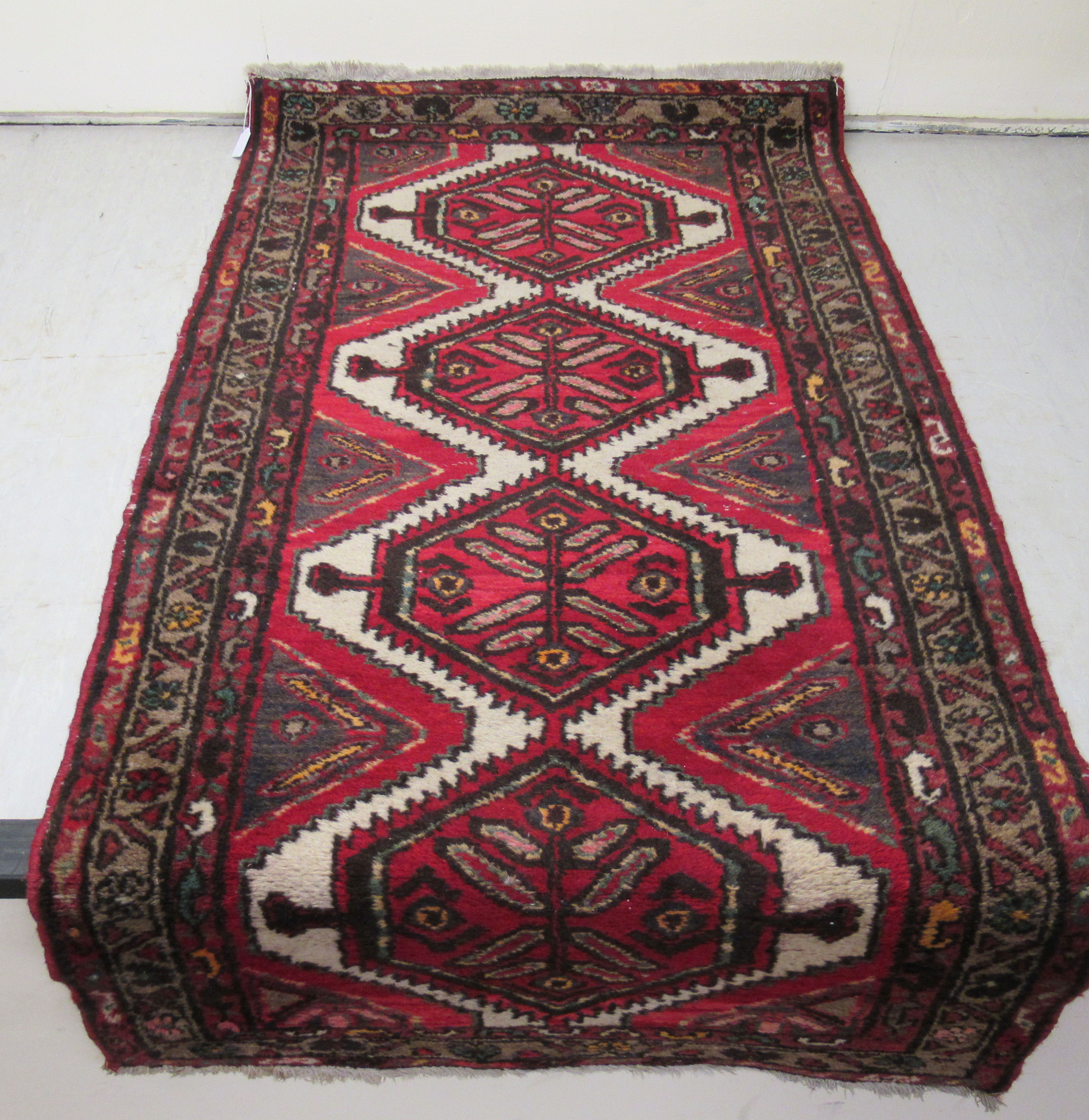 Five small Persian and other rugs, decorated in various styles, - Image 6 of 6