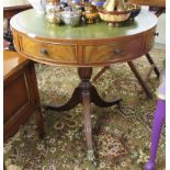 A modern Regency style mahogany drum table, the top set with a tooled green hide scriber,