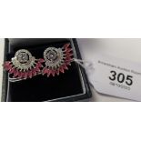 A pair of silver and cubic zirconia set earrings 11