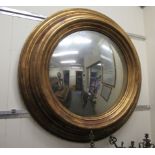 A Regency inspired convex mirror, set in a wide,
