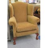 A Georgian style wingback armchair,