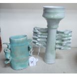 Two 20thC Oriental inspired studio pottery celadon glazed vases of free form design,