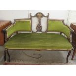 An Edwardian bone and string inlaid mahogany framed two person settee,