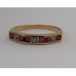 A yellow metal diamond and ruby half eternity ring 11