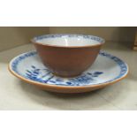 A mid 18thC Chinese porcelain Nanking Cargo tea bowl and saucer,