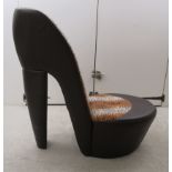 A modern bedroom chair, fashioned as a stiletto,