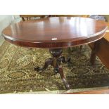 An early Victorian mahogany, oval, tip-top breakfast table, raised on a bulbous column,