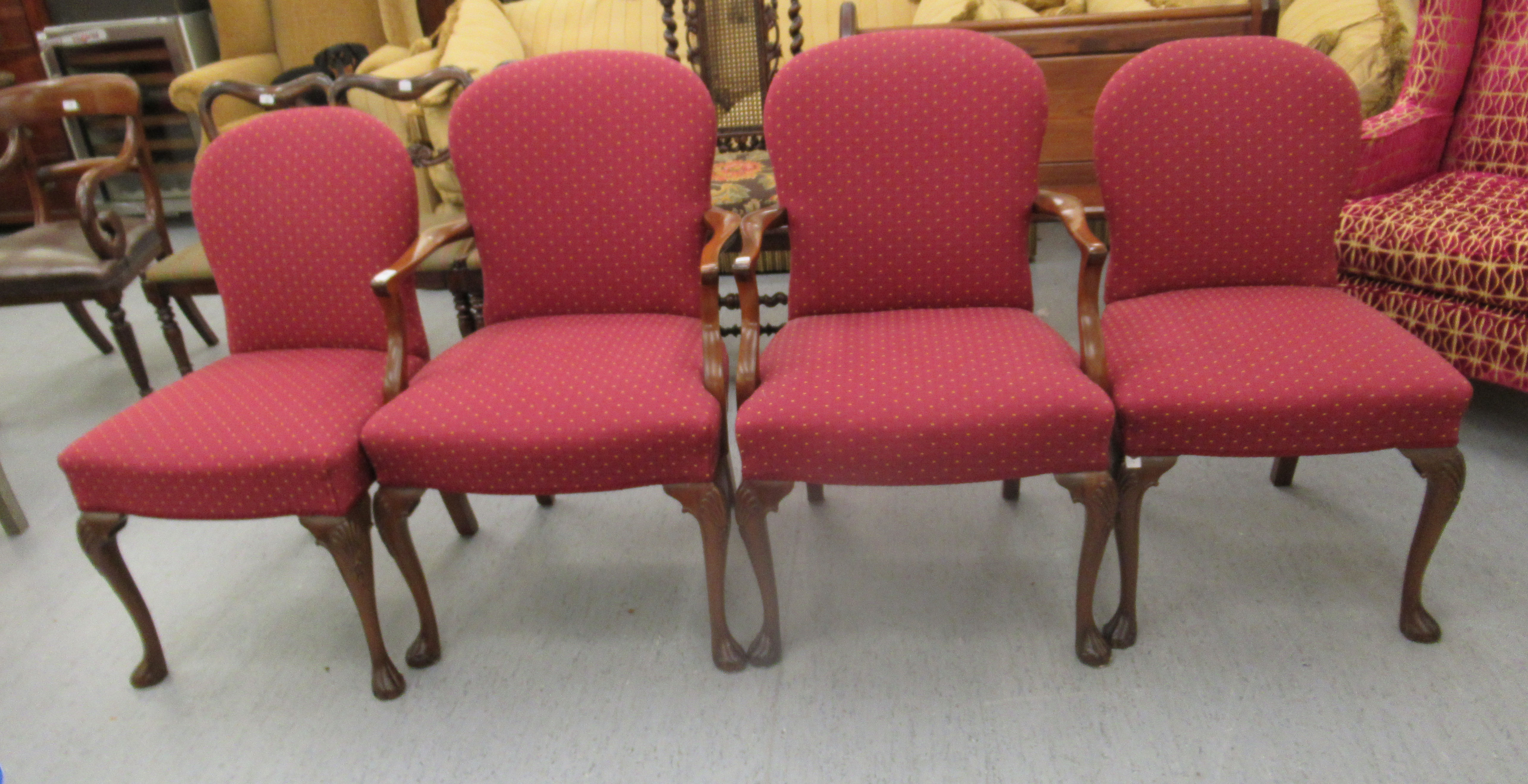 A pair of 20thC mahogany framed, open arm chairs,