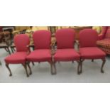 A pair of 20thC mahogany framed, open arm chairs,