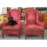 A pair of 20thC Designer's Guild pink and gold coloured upholstered wingback reception chairs,