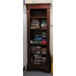 A Georgian inspired mahogany finished open front bookcase with roundel turned and fluted flanks,