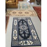 Three Chinese washed rugs,