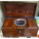 A Regency mahogany tea casket with a hinged lid, enclosing two caddies and a mixing bowl 6.
