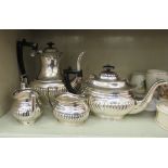 A mid 20thC Ashbury silver plated four piece tea set of oval demi-reeded form comprising a coffee