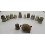 Eleven 19th/early 20thC silver thimbles with varying decoration: to include one in a hide covered