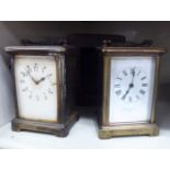 A 1930s lacquered brass cased carriage clock with bevelled glass panels and a folding top handle