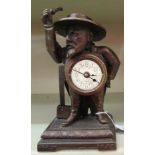 A Continental bronze finished metal cased novelty mantel timepiece, featuring a caricature figure,