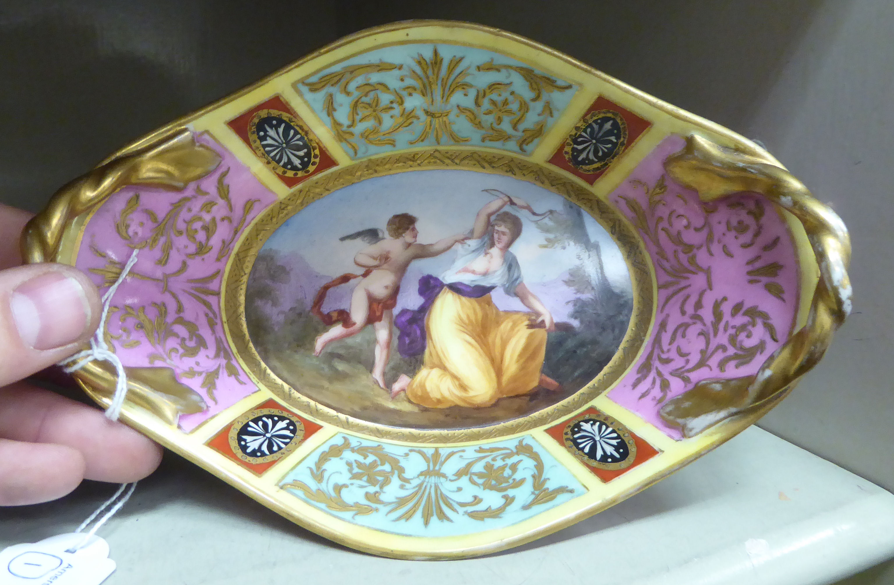 A late 19thC Vienna porcelain shallow dish with a gilded opposing ropetwist design handles, - Image 2 of 5