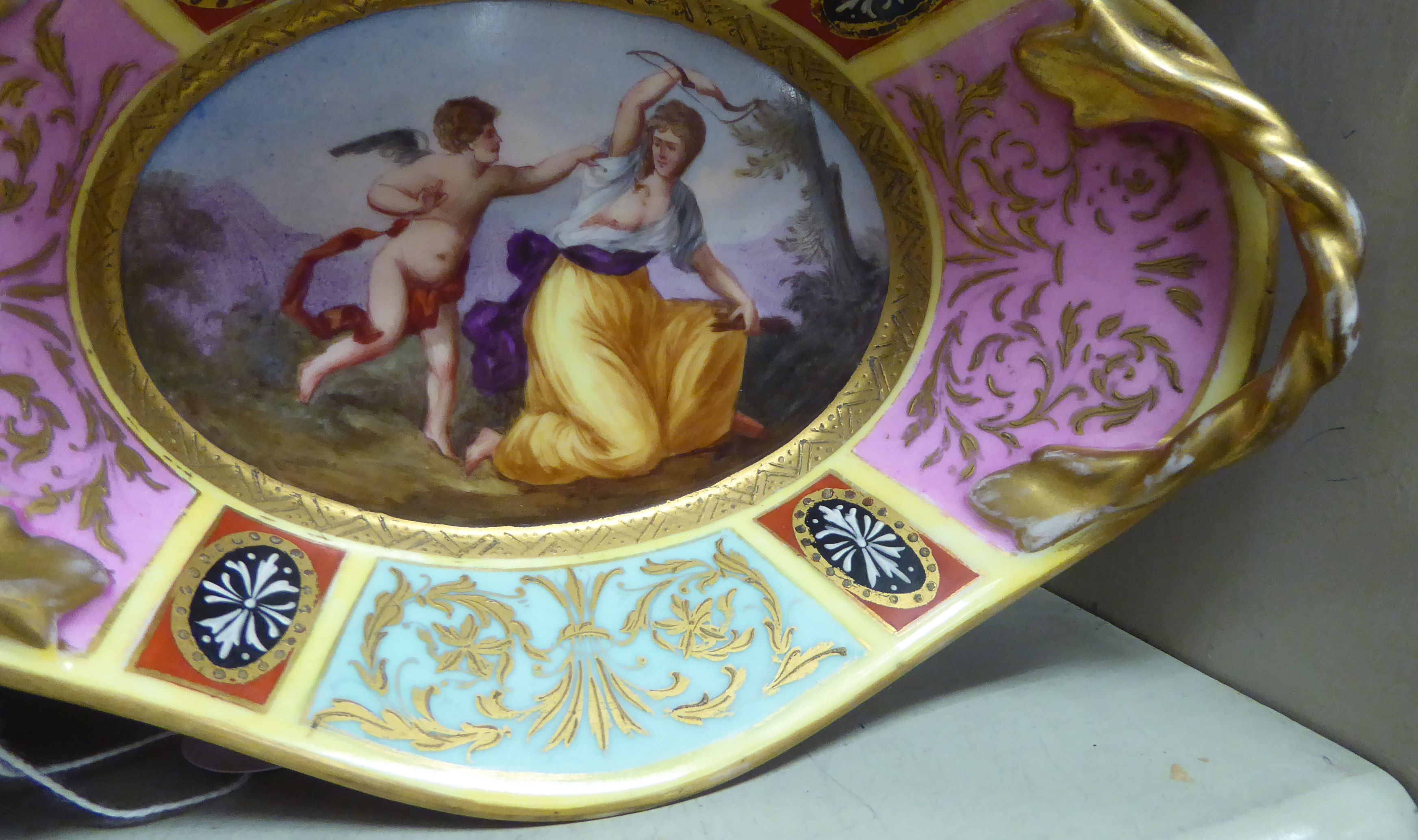 A late 19thC Vienna porcelain shallow dish with a gilded opposing ropetwist design handles, - Image 5 of 5
