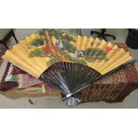 A modern Japanese black lacquered and overpainted gilded fan 42''h 64''w (open) CS