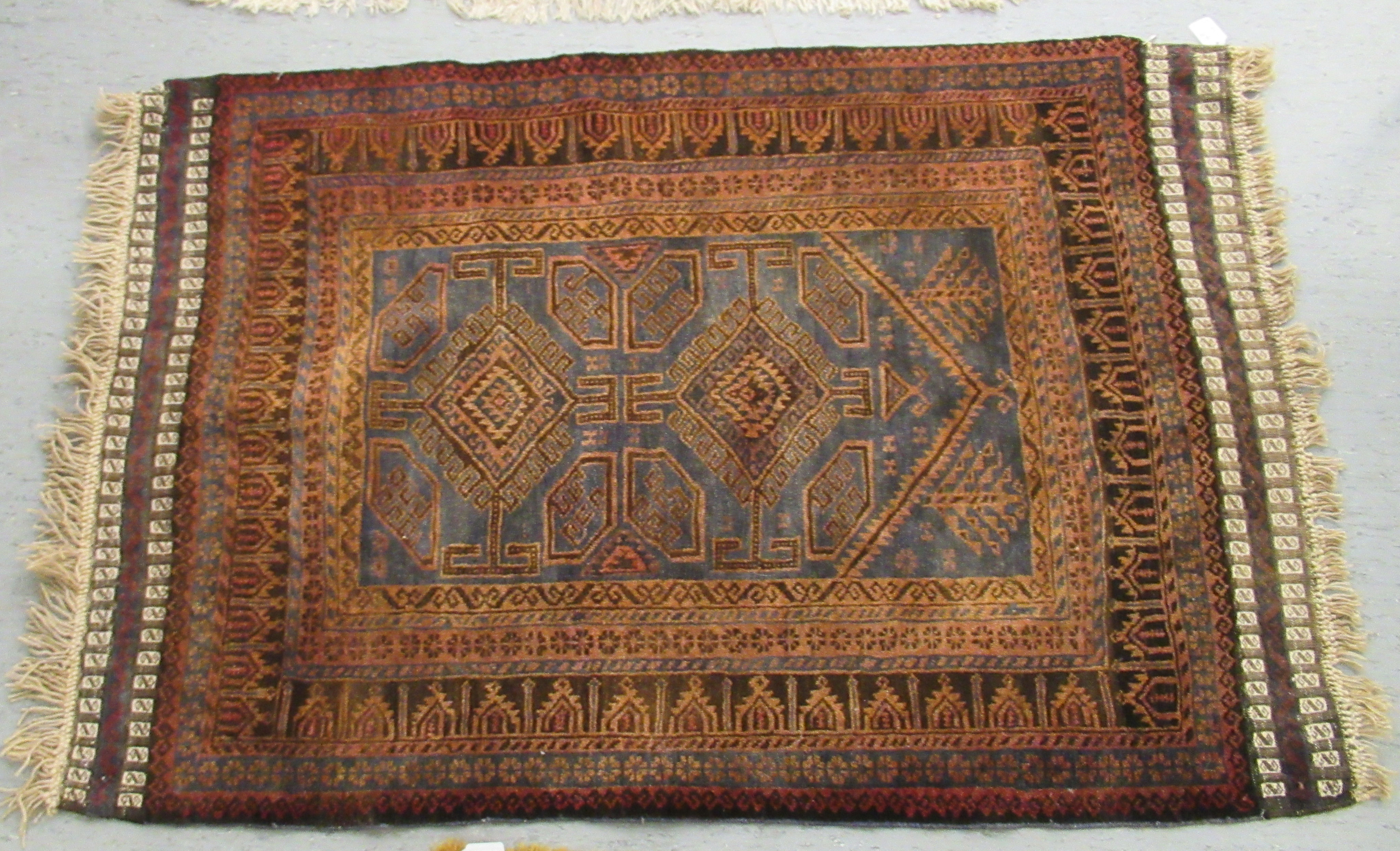 Two woollen Persian rugs, decorated in stylised designs, - Image 3 of 5