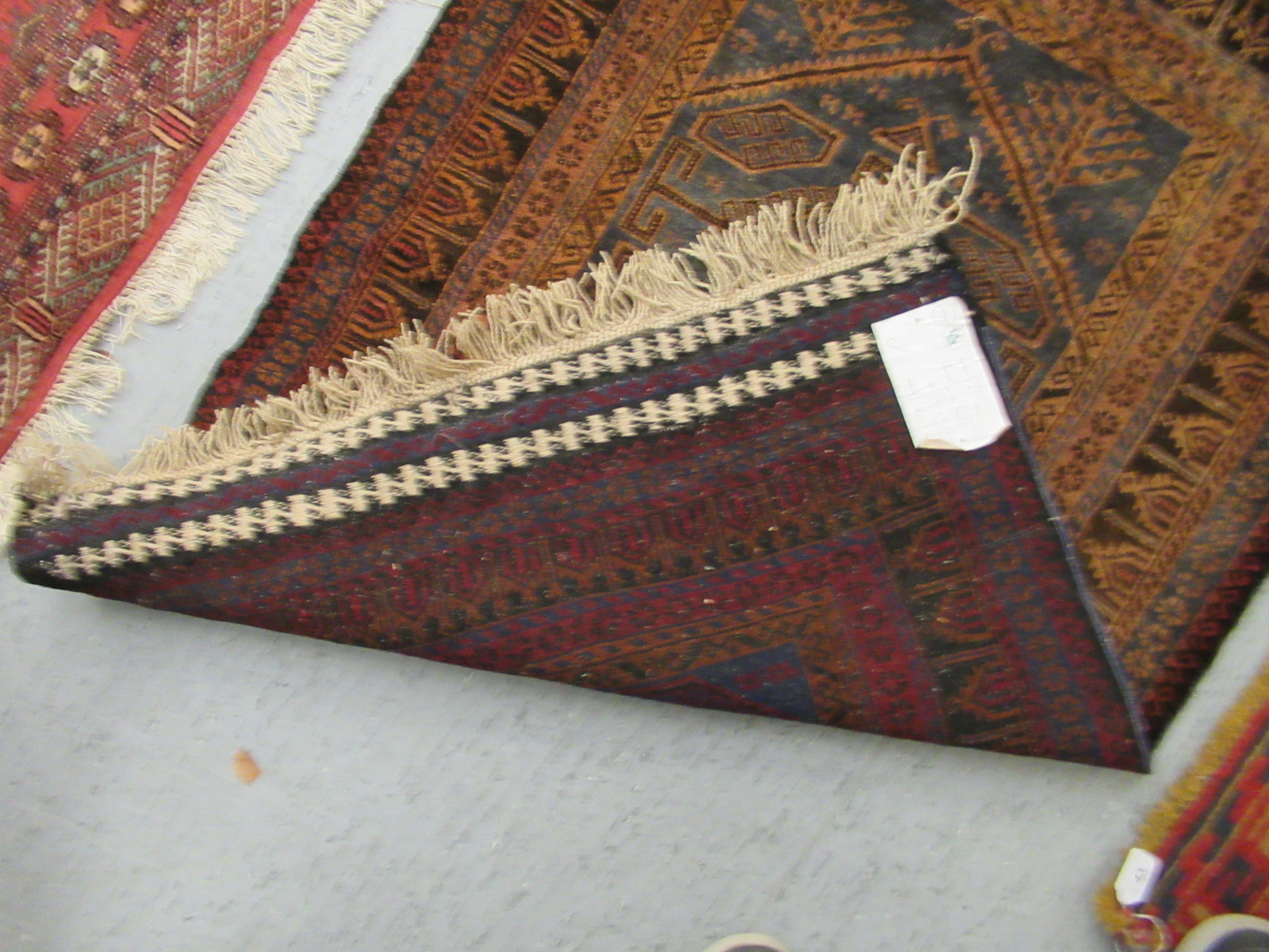 Two woollen Persian rugs, decorated in stylised designs, - Image 4 of 5