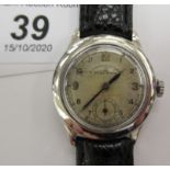 A 1940s Election military type stainless steel cased chronometer, faced by an Arabic dial,