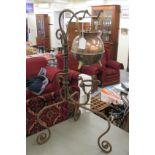 A Benham & Froud copper and brass spherical kettle in the manner of Dresser with a straight spout,
